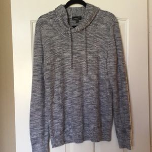 Knitted grey sweater.